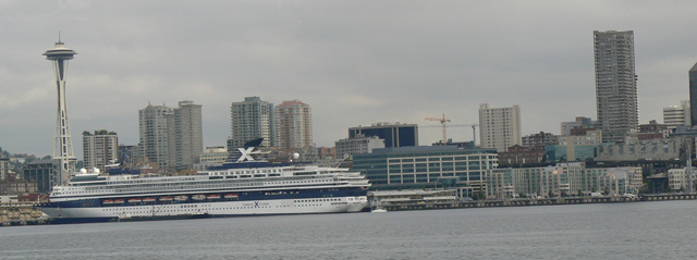 The Space Needle and Cruise Ships framed by the gray skies of Seattle, Washington
