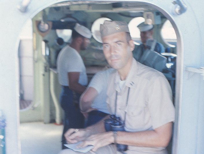 LT RE Coffman looking out the starboard hatch of the USS Sproston (DD-577) bridge- March 1966 