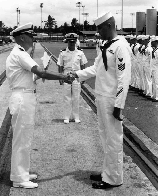 USS Sproston (DD-577) CDR Hoffman presenting FT1 with an award during Personal Inspection, Baker Pier, Honolulu, Hawaii - 1966