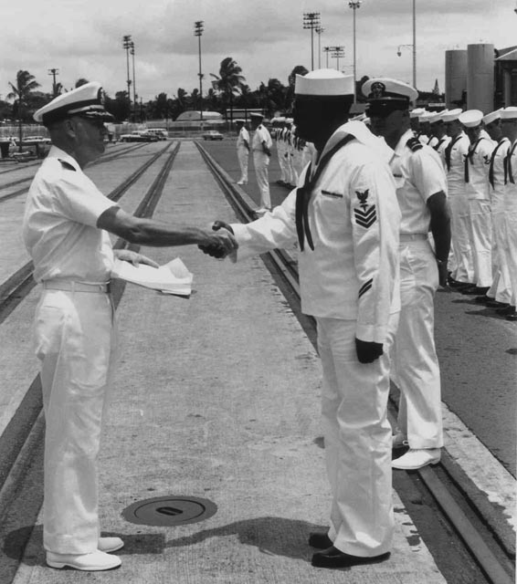 USS Sproston (DD-577) CDR Hoffman presenting award to HM1, Baker Pier, Honolulu, Hawaii - 1966