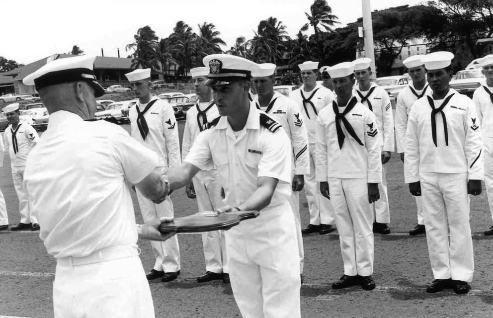 USS Sproston (DD-577) CDR Hoffman presenting award to Supply Officer, Baker Pier, Honolulu, Hawaii - 1966