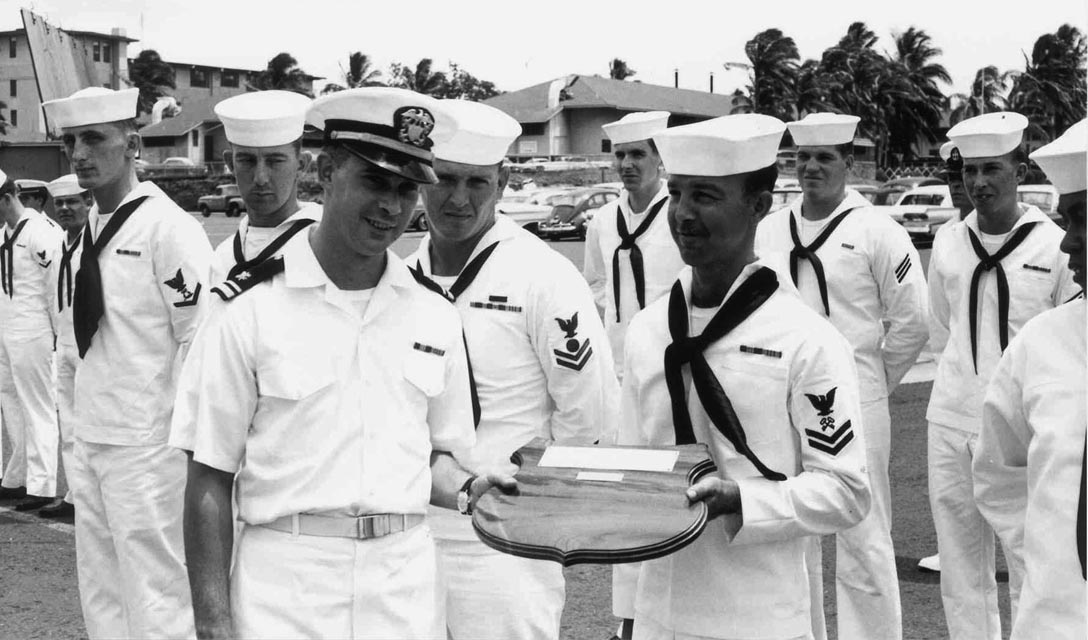 USS Sproston (DD-577) Supply Officer showing of award, Baker Pier, Honolulu, Hawaii - 1966