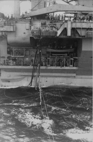 Here comes the refueling hose from the USS Kitty Hawk (CV 63)  