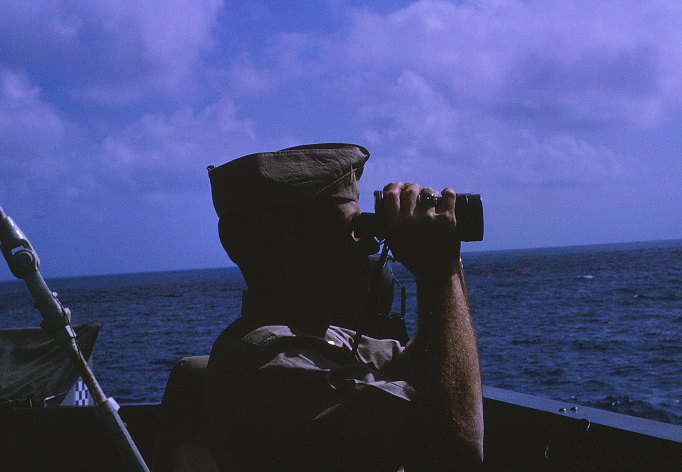 LTjg Hettel on watch from starboard wing of USS Sproston (DD-577) bridge - March 1966 