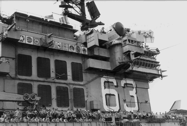 Spectators on the USS Kitty Hawk (CV 63)  during refueling with the USS Sproston (DD 577)
