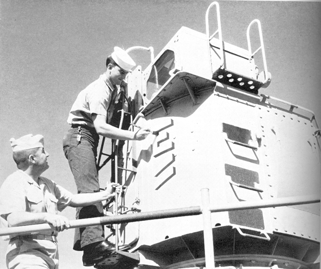 FTC Bill Fell & FTG3 Tom Camargo painting the Battle E (with hash marks) on the Mk. 56 Director - USS Sproston
