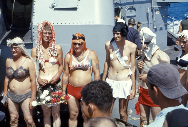 SN M. Munoz, SN J. Dockins, unidentified shipmate, ET3 D. Kranuvich and unidentified crossing the equator - USS Sproston 1967